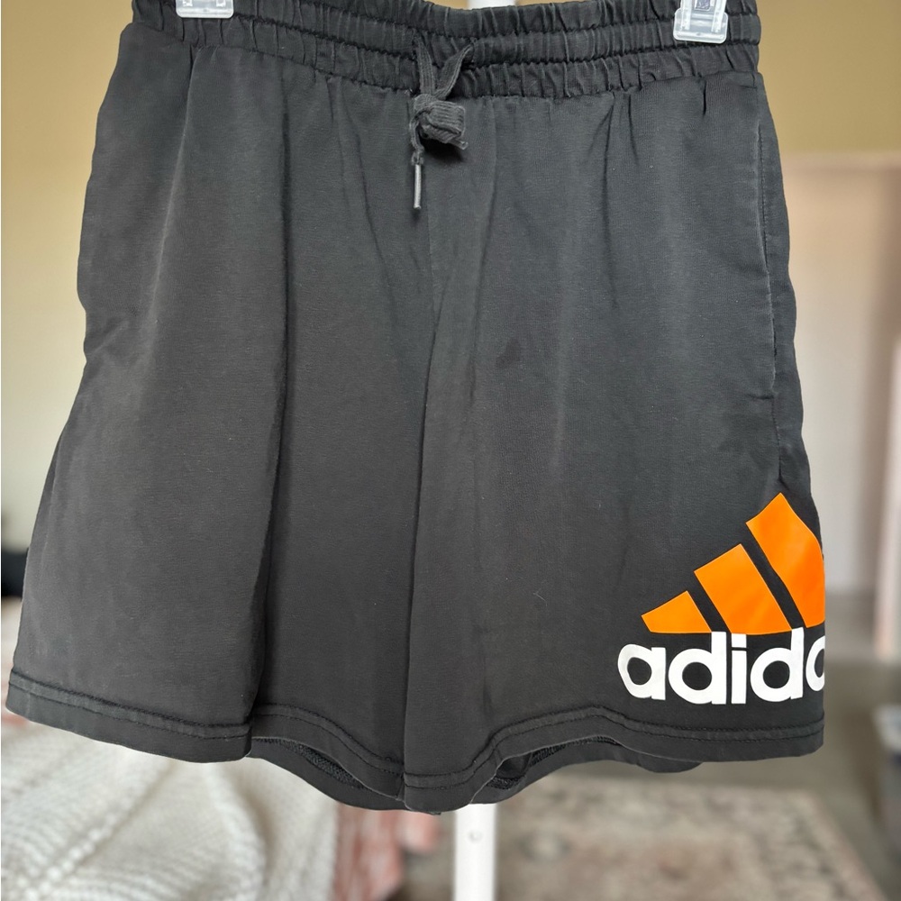 Adidas Black Athletic Shorts with Vibrant Orange Logo